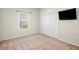 This cozy bedroom has a window, closet, tv, neutral paint, and neutral carpet at 12214 Streambed Dr, Riverview, FL 33579