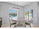 Cozy dining area with a view of the pool and backyard through a window at 12214 Streambed Dr, Riverview, FL 33579
