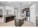 Spacious kitchen featuring dark cabinets, granite countertops, and stainless steel appliances at 12214 Streambed Dr, Riverview, FL 33579