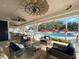 Relaxing covered lounge area with unique fans offering views of the pool and community amenities at 12214 Streambed Dr, Riverview, FL 33579