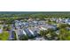 An elevated neighborhood view displays harmonious homes, lush greenery, and winding streets, crafting a serene and welcoming environment at 12520 Shimmering Oak Cir, Venice, FL 34293