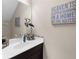 Stylish half-bath with nautical decor and attractive vanity at 12520 Shimmering Oak Cir, Venice, FL 34293