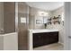 Bathroom featuring a glass enclosed shower and double sink vanity at 12520 Shimmering Oak Cir, Venice, FL 34293
