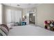Bedroom with a view into the playroom, closet, modern lighting, and playful decor at 12520 Shimmering Oak Cir, Venice, FL 34293