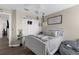 Nicely decorated bedroom with ceiling fan, closet, and comfortable bedding at 12520 Shimmering Oak Cir, Venice, FL 34293