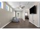 Spacious bonus room featuring vinyl flooring, a ceiling fan, and multiple windows allowing for natural light at 12520 Shimmering Oak Cir, Venice, FL 34293