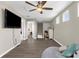 Bright bonus room with vinyl flooring, ceiling fan, and access to other rooms at 12520 Shimmering Oak Cir, Venice, FL 34293