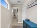 Hallway with tile flooring and plenty of natural light at 12520 Shimmering Oak Cir, Venice, FL 34293