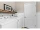 Convenient laundry room with modern appliances and ample space at 12520 Shimmering Oak Cir, Venice, FL 34293