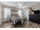 Cozy main bedroom with wood floors, natural light, and stylish decor at 12520 Shimmering Oak Cir, Venice, FL 34293