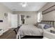 Spacious main bedroom with ensuite bathroom access and comfortable furnishings at 12520 Shimmering Oak Cir, Venice, FL 34293