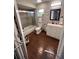 Bathroom with wood-look tile floor, bathtub-shower combo, vanity, and decor at 14432 Mcclellan Ave, Port Charlotte, FL 33953