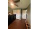 Cozy room with a closet, neutral paint, and wood-look floors, suitable for a bedroom or home office at 14432 Mcclellan Ave, Port Charlotte, FL 33953