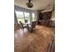 Bright kitchen nook featuring travertine tile, modern table and chairs, and serene backyard views at 14432 Mcclellan Ave, Port Charlotte, FL 33953
