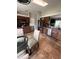 Spacious eat-in kitchen with stainless appliances, dark cabinetry, and open view to the living area at 14432 Mcclellan Ave, Port Charlotte, FL 33953