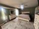 Bright main bedroom with a ceiling fan, carpet flooring, large windows, and ample closet space at 14432 Mcclellan Ave, Port Charlotte, FL 33953