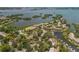 Aerial image showcasing a waterfront community with lush landscaping and picturesque marina views at 1609 Bayhouse Point Dr # 232, Sarasota, FL 34231