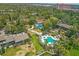 Breathtaking aerial view of two pools nestled among lush greenery and inviting walkways at 1609 Bayhouse Point Dr # 232, Sarasota, FL 34231