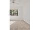 Carpeted bedroom featuring a large window with outside view at 1609 Bayhouse Point Dr # 232, Sarasota, FL 34231