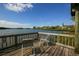 Waterfront wooden deck area features chairs and scenic views at 1609 Bayhouse Point Dr # 232, Sarasota, FL 34231