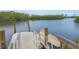 A private dock provides direct water access, with calm waters and green mangroves creating a peaceful atmosphere at 1609 Bayhouse Point Dr # 232, Sarasota, FL 34231