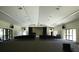 Spacious community hall with ample seating, stage, and lighting, perfect for events and gatherings at 1609 Bayhouse Point Dr # 232, Sarasota, FL 34231
