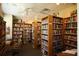 A well-stocked library with floor-to-ceiling bookshelves filled with books, creating a quiet reading and study space at 1609 Bayhouse Point Dr # 232, Sarasota, FL 34231