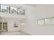 Bright living room features a high ceiling with large windows offering natural light at 1609 Bayhouse Point Dr # 232, Sarasota, FL 34231
