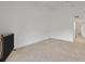 Open living room area with a ceiling fan and carpeted flooring, ready for personalized decor at 1609 Bayhouse Point Dr # 232, Sarasota, FL 34231