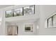 Inviting living area with high ceilings, expansive windows, and modern fixtures at 1609 Bayhouse Point Dr # 232, Sarasota, FL 34231