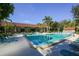 Community pool with lounge chairs, perfect for relaxing in the sun at 1609 Bayhouse Point Dr # 232, Sarasota, FL 34231