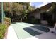 Community shuffleboard court next to building, offering a fun and social outdoor activity at 1609 Bayhouse Point Dr # 232, Sarasota, FL 34231