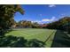 Community tennis courts surrounded by trees, ideal for active recreation at 1609 Bayhouse Point Dr # 232, Sarasota, FL 34231