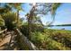 Picturesque community walkway with lush landscaping and water views, providing scenic enjoyment at 1609 Bayhouse Point Dr # 232, Sarasota, FL 34231
