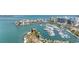 Breathtaking aerial view of the marina, park, and waterfront condos, offering a vibrant coastal lifestyle at 174 Golden Gate Pt # 21, Sarasota, FL 34236