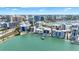 Aerial view of waterfront city, beaches, and boats at 174 Golden Gate Pt # 21, Sarasota, FL 34236