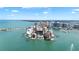 Overhead view of buildings, docks, and bay at 174 Golden Gate Pt # 21, Sarasota, FL 34236
