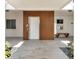 Elevator entryway featuring stone flooring, wooden accents and well-lit space at 174 Golden Gate Pt # 21, Sarasota, FL 34236