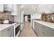 Modern kitchen featuring stainless steel appliances, sleek countertops, and stylish backsplash, perfect for cooking enthusiasts at 174 Golden Gate Pt # 21, Sarasota, FL 34236