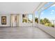 Bright living room with large windows providing lots of natural light and serene waterfront views at 174 Golden Gate Pt # 21, Sarasota, FL 34236