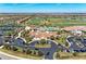 Aerial view showcasing the clubhouse, pool, and meticulously maintained landscaping within a vibrant community at 18114 Gawthrop Dr # 201, Bradenton, FL 34211