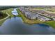 This aerial view captures the community's pond, golf course, and neighboring residences at 18114 Gawthrop Dr # 201, Bradenton, FL 34211