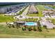 This aerial view captures the community's pool, clubhouse, and manicured landscaping at 18114 Gawthrop Dr # 201, Bradenton, FL 34211