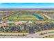 Panoramic aerial shot of a community featuring a golf course, clubhouse, and scenic lakes at 18114 Gawthrop Dr # 201, Bradenton, FL 34211