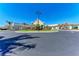 Beautifully landscaped clubhouse entrance with palm trees and a circular driveway at 18114 Gawthrop Dr # 201, Bradenton, FL 34211