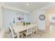 Elegant dining room featuring a wooden table and chairs, stylish decor, and neutral tones for a warm ambiance at 18114 Gawthrop Dr # 201, Bradenton, FL 34211