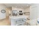 Well-equipped kitchen with stainless steel appliances, a center island, and bar stool seating in an open layout at 18114 Gawthrop Dr # 201, Bradenton, FL 34211