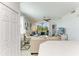 Cozy living room featuring an open floor plan to the kitchen and balcony access with a view at 18114 Gawthrop Dr # 201, Bradenton, FL 34211