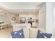 Bright and modern living room with a view of the kitchen, featuring comfortable seating and contemporary decor at 18114 Gawthrop Dr # 201, Bradenton, FL 34211