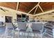 Outdoor bar featuring stone countertop, TV, and comfortable seating at 18114 Gawthrop Dr # 201, Bradenton, FL 34211